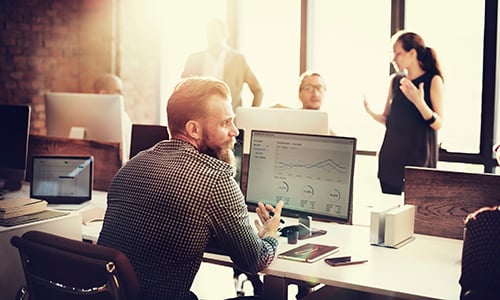 Businessman working on his computer in an open office