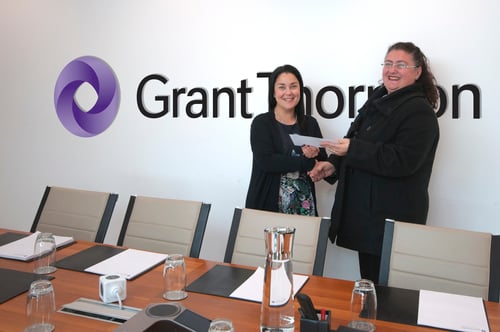 Joeanna Xerri and Rebecca Delicata shake hands in a Grant Thornton meeting room