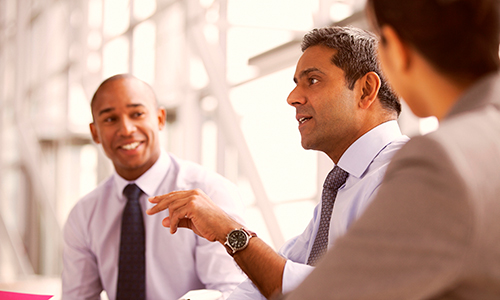 Three businessmen talking together